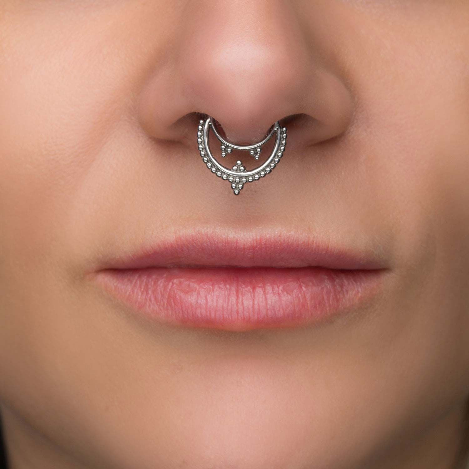 saddle nose from septum piercing